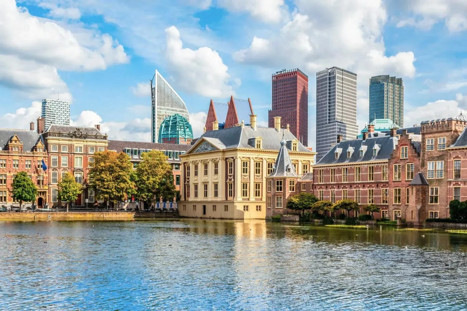 The Binnenhof government complex in The Hague with the city skyline behind it