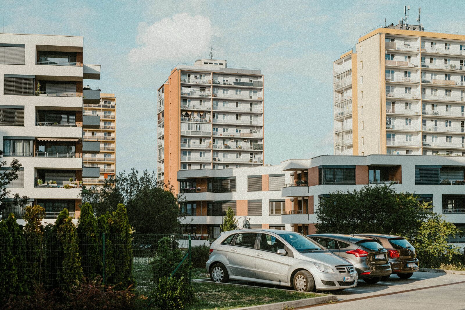 Modern European apartment blocks with a residential parking area